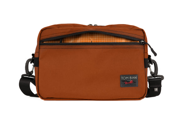 The Side Hustle in Burnt Orange Ballistic with Zest (orange) 200 Halcyon interior.